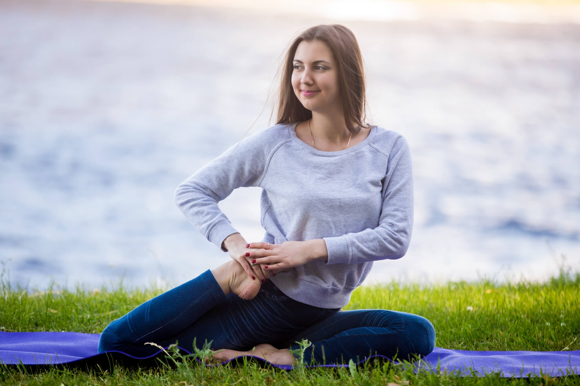 Woman sitting outdoors for a wellness and health care image